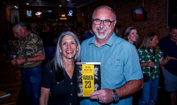 Former Olney Police Chief Dan Birbeck took time out of his schedule as police chief for the City of Vernon to attend the Aug. 17 book signing at Hudson’s on Main, sponsored by the Olney Enterprise. (L-R): Author Gina Keating, Dan Birbeck. Photo by Will 