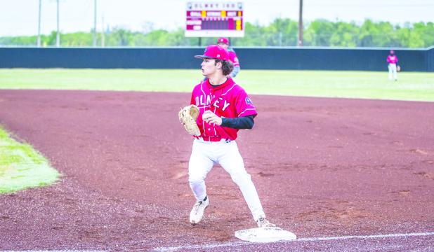 OHS Cubs first baseman #5 Kanton Rodgers catches an out in the first inning and continues to be an asset as the Cubs first baseman this season. Photo by Will Sadler