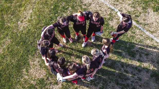 OHS Lady Cubs circle up for a last minute pow wow before taking on Knox City for their first game in the OISD Tourney. Photo by Will Sadler