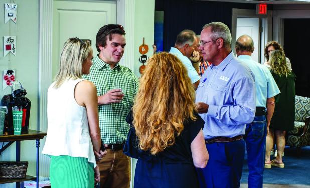 Olney ISD board president Summer Branum and Olney City Attorney Dan Branum visit with First State Bank vice president David Parkey and his wife Vanessa Parkey at the Olney Chamber’s Back to School mixer at First State Bank. Photo by Will Sadler