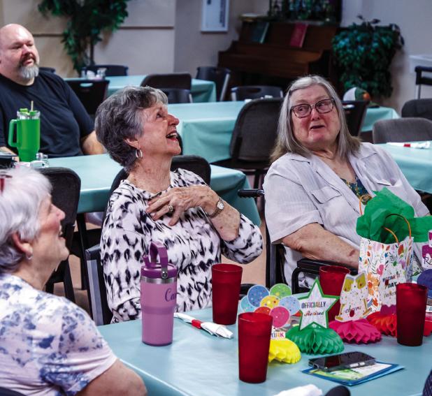 Edwana Fikes, a longtime volunteer at the Olney Senior Cub Center, reacts to thanks by Center director Angela Lockard. Photo by Will Sadler