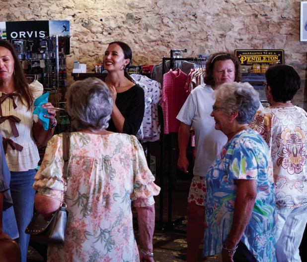 Archer & Gunn Mercantile hosted a meet and greet for a new local artist. Attendees chat over drinks and snacks as they get to know Christen Horner and husband Dr. John Horner. Photo by Will Sadler