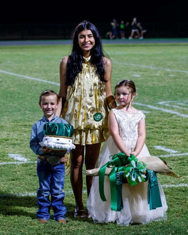 This year’s court included the NHS 2025-26 HOCO Queen Flor Carranza escorting the Hero Crown Holder Brentley Campbell and Queen’s Flower carrier Kirby Chenault, who made just an adorable trio before the pack stands.