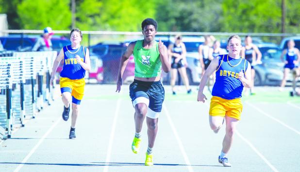NHS Bobcat Jacob Omundi gave the competition a run during the 100m. Pick up a copy of the Enterprise next issue for results of the NHS Coal Mine Relays. Photo by Will Sadler