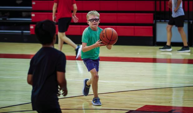 A Cub practices his passing skills during camp. Photo by Will Sadler