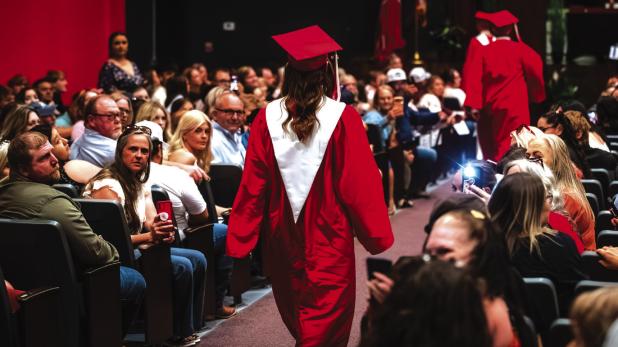 Students, parents, family and friends pack the auditorium to overflow for the 2026 Olney High School Graduation Ceremony on the evening of May 15. Photo by Will Sadler