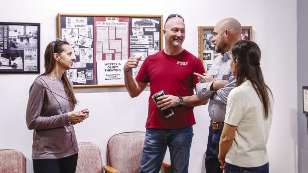 Hudson’s on Main proprietors Lisa Hudson (L) and Dustin Hudson (Center) mingle with City Council candidate Sammy Livingston and his wife, Andrea, at the Olney Chamber of Commerce’s Mix and Mingle event on Feb. 24. Photo by Will Sadler