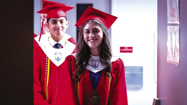 OHS Valedictorial Morgan Simmons proudly waits to walk to the stage to receive her diploma. Photo by Will Sadler