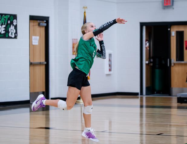 Ladycat #5 Allison Melton serves during game one against the Graford Lady Rabbits. Photo by Will Sadler