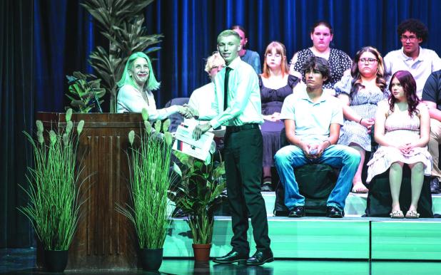 Olney Enterprise Editor Gina Keating (L) awards Caden Lane (R) a Perry Foundation scholarship. Photo by Will Sadler