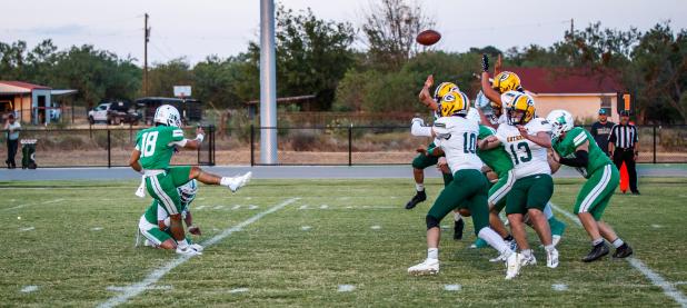 Caption: NHS Bobcat #18 Keyton Newland, RB/QB, has one of the best legs in the district and kicks bombs through the uprights, rarely missing his mark.