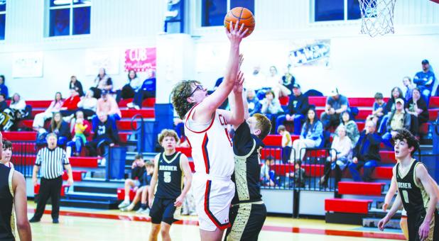OHS Cub #15 Luke Lane continued a season of domination under the bucket against the Wildcats and came away with 7 points. Photo by Will Sadler