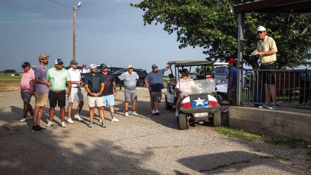 Olney Recreation Association President Landon Rowe (right) gathers golfers of the CEMCO Invitational to go over rules and assign holes for the tourney. Mr. Rowe has been a huge advocate and is a major factor in the revitalization of the Olney Country Club
