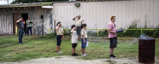 Olney American Legion Post 414 had the help of the Olney Cub Scout Troop 414 for their annual flag retirement ceremony on Sunday, the conclusion of National Flag Week. Participants salute as “To The Color” was played, as the flags were retired to the 