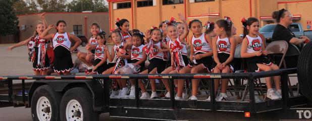 Top of Texas Cheerleaders who cheer for elementary school sports teams, ride in the Homecoming parade on Wednesday, Sept. 16 to a pep rally at Cub Stadium. Photo by Kailyn Altmiller