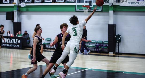 Bobcat #3 Keyton Newland makes layups with flare and grace on the boards against the Greyhounds. Photo by Will Sadler