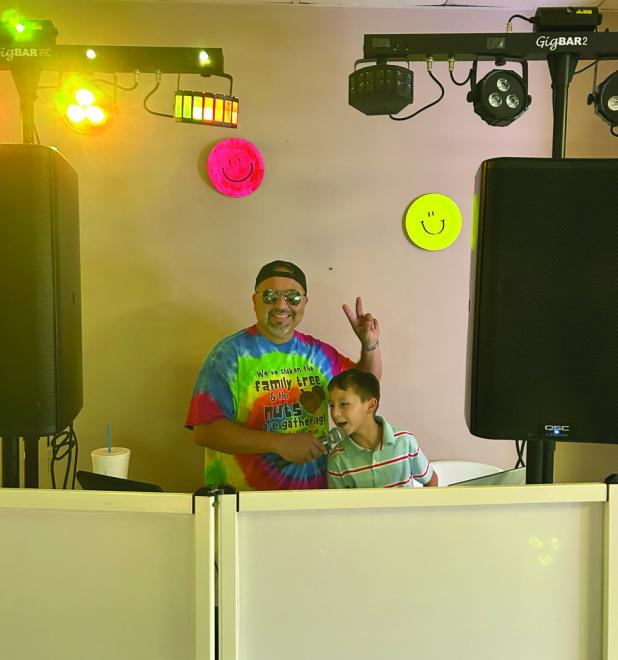 DJ Chris Widner spun the tunes at the Senior Cub Center dance, helped by his son. Photo by Candy Blair