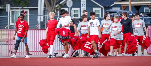 The OJH Cubs red team walk confidently onto Cub Field, ready to battle with the Roscoe Plowboys. Photo by Will Sadler