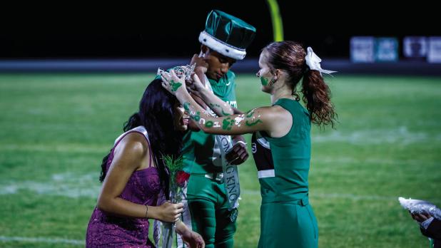 NHS Cheerleader Kourtney Whitfield Crowns the HOCO Queen and Hero. Photo by Will Sadler