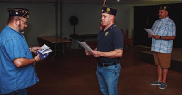 The Olney American Legion Post 414 performed a flag retirement ceremony on Sunday evening. The ceremony includes a flag inspection and prayer shown here. City Councilmember and Legion Chaplain Steven Nurre, Post Vice Commander Eric Loggins, and Post Comma