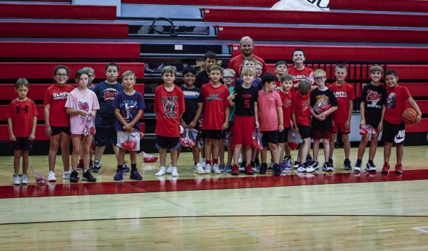 The second through fourth graders showed up in force for Coach Symank’s summer basketball skills camp. Photo by Will Sadler