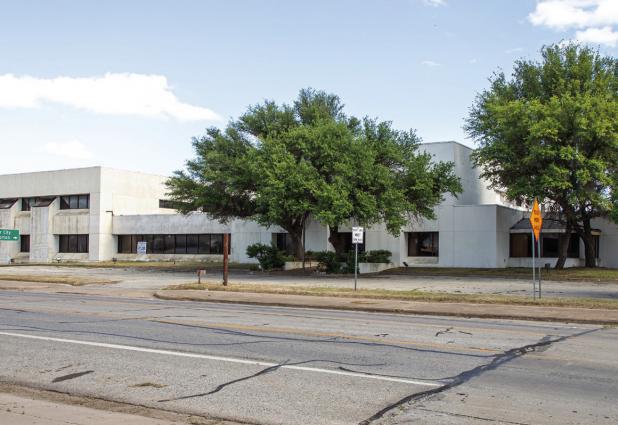 Representatives from a California precision manufacturing company are in town evaluating the former Olney Savings and Loan building as a potential production site. Photo by Gina Keating