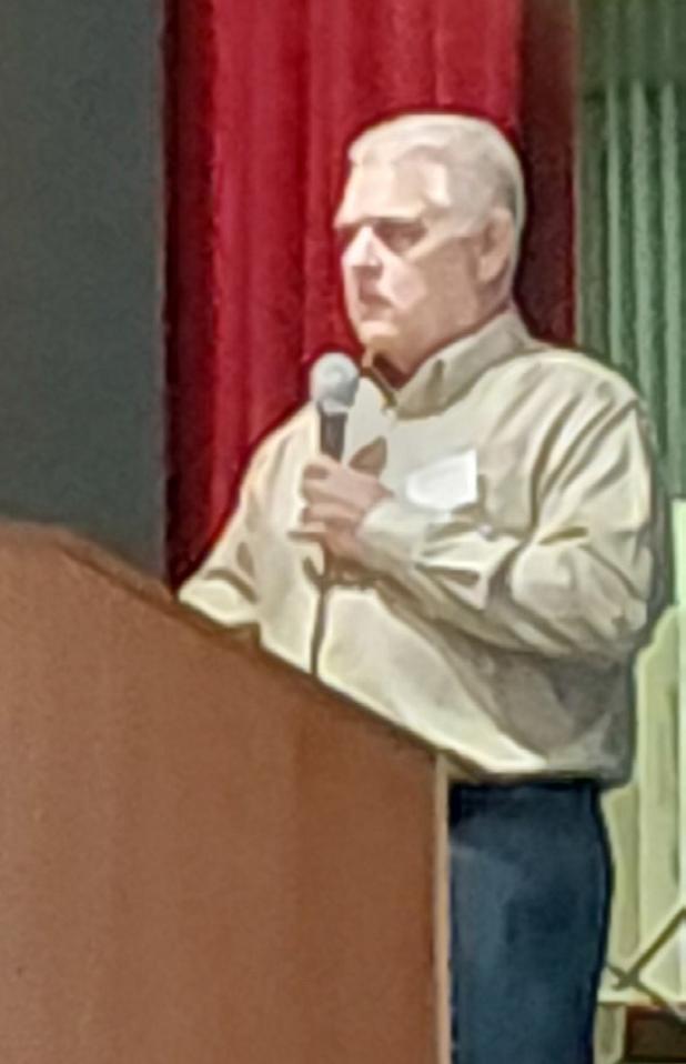 Brazos Communications CEO Kyle Hinson reports on the consumer-owned company’s 2025 performance at its annual meeting at the Olney High School Auditorium. Photo by Gina Keating
