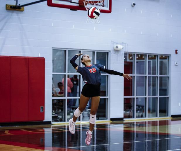 OJH Lady Cub #19 Janie Sykora serves during the match-up with the Lady Indians. Sykora will be one to keep your eye on; her skill level is already on par with a JV player. Photo by Will Sadler