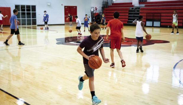 New basketball coach hosts