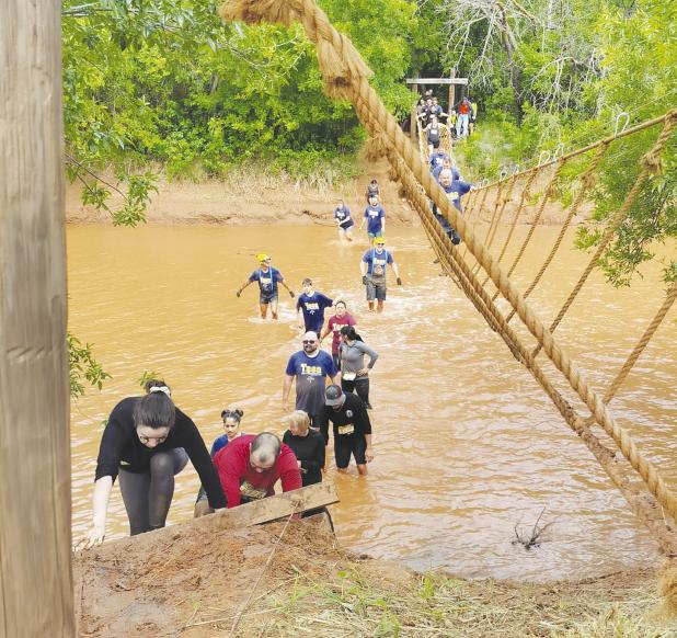Texoma’s Hellacious Obstacle Run (THOR) features a 5K obstacle course through Lacy Park, food trucks, and a compulsory crossing of the Wichita river. Photo by Deanna Baran