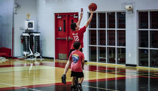A Cub camper shoots a floater from the paint.