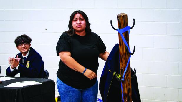Senior Jazmine Hammond got very sentimental as she performed the FFA ritual of hanging her jacket up at the end of year NHS FFA banquet. Outgoing seniors of the FFA hang their jackets up symbolically ending their time with the FFA. Other seniors ending th