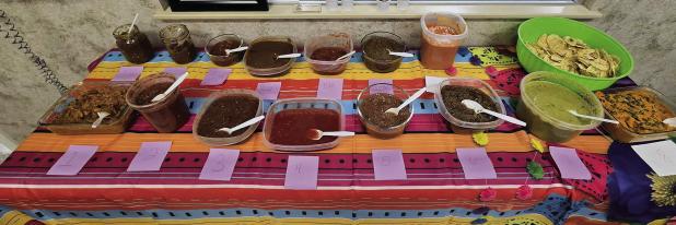 The crew at Tower Extrusions held their 15th annual Cinco de Mayo salsa contest on May 5, where folks dropped by this table to vote for “Best Hot” and “Best Mild” salsas. The winners received gift cards and bottles of salsa. Photo by Heather Givha