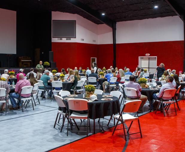 Community members enjoyed a barbecue meal and reminisced about The Refuge’s 10-year mission to support local children, families, and churches . Photo by Will Sadler