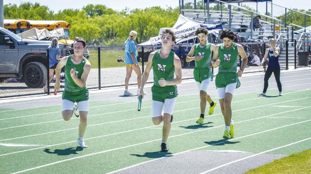NHS Bobcat Relay Team Leighton Gowens, Ryder Ebert, Hudson Hill, and Joey Soito moving on in the 4x1 and 4x2 relay. Photo by Will Sadler