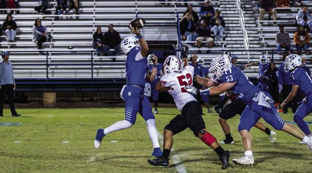 Cub defender #52 Jacobi Esquivel pressures the Bulldog QB hoping for a mistake downfield. Photo by Will Sadler