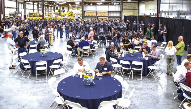 Air Tractor employees and local leaders enjoy a luncheon at the Air Tractor plant in Olney to celebrate the company’s completion of its 5,000th aircraft on May 28. Photo by Will Sadler