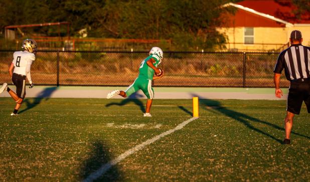JV Bobcat #5 Hudson Hill TD raced past Jaybird defenders and came within inches of a scoring run to open the quarter. Photo by Will Sadler