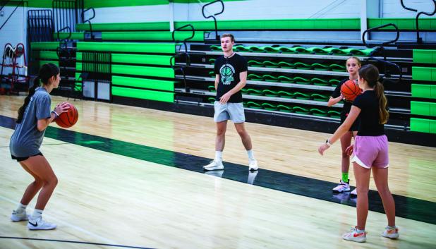Student athletes learned the importance of passing during summer basketball camp. Photo by Will Sadler