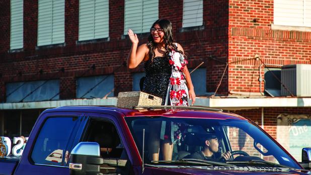 OHS Homecoming Queen nominees Allison Alvarado waves to parade attendees. Photo by Will Sadler