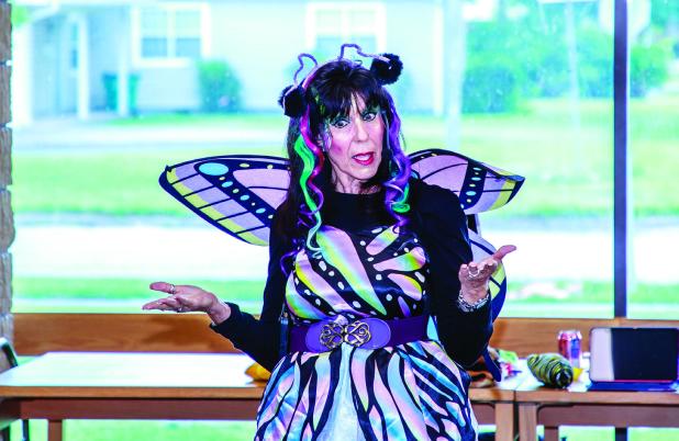 Ms. Maria had the children attending her storytime at the OCLAC hanging on every word during one of her Cool Time adventures. Photo by Will Sadler