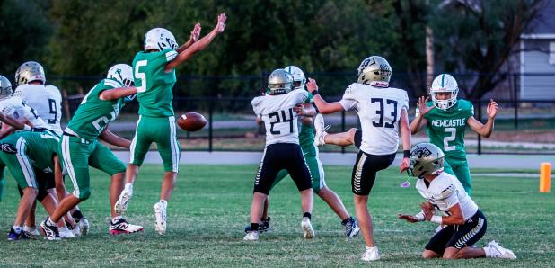 JV Bobcat #5 Hudson Hill blocks a Jaybird extra point. Photo by Will Sadler