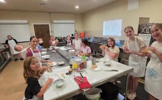 (Top right): Kids at this year’s Science Camp at The Refuge Christian Community Center show off their paintings of the galaxy after learning about constellations, non-Newtonian fluids, and chromatography. (Bottom right): Student chefs spent Cooking Camp