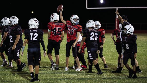 Cub Midget #10 Brennon Horner recovered a fumble against the Vernon Lions. Photo by Will Sadler