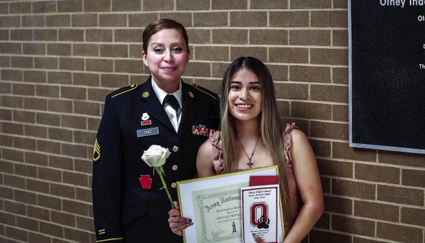 OHS Student Krystal Hernandez received special acknowledgement for enlisting in the U.S. Army National Guard. Army representative Staff Sergeant Zelene Diaz presented Krystal with the special award in front of her peers during the Senior Scholarship cerem