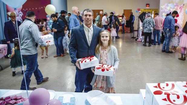 Father and Daughters enjoyed Chic-A-Fil-A during the KOB dance and fundraiser on Feb. 21. Photo by Will Sadler
