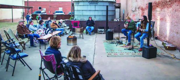 Local community members braved the chilly night air to enjoy a free concert featuring Race Rickett and Nick Brumley at Archer &amp; Gunn Mercantile’ s fifth anniversary celebration, which featured in-stores discounts, jewelry-making demonstrations and n