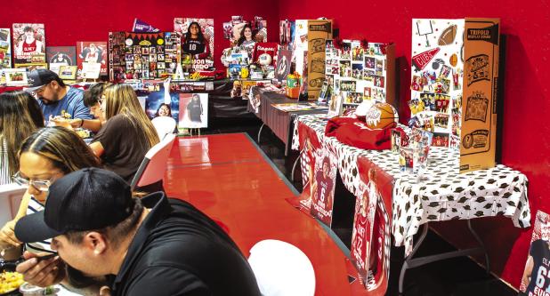 Senior tables are a time-honored tradition for parents and student athletes. The tables are full of memories and accolades. Photo by Will Sadler