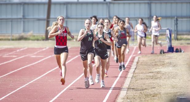 Second and third place finishers in the 800m, NHS Allison Melton [front] and Greenleigh Moore [right]. The runners finished in the same order in the 1600m. Photo by Will Sadler