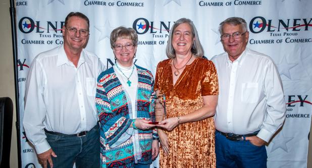 (Above): Jeff Camp, Holly Camp, Kris Camp, and Rand Camp, proprietors of the ACE Hardware in Olney, were recognized as the Olney Chamber’s Business of the Year at the 100th anniversary banquet. Photo by Will Sadler